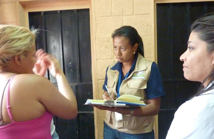 A woman detainee is interviewed 
