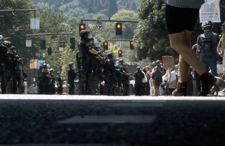 Police and protesters meet in a street in the United States